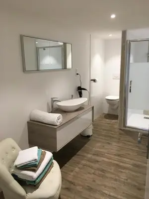 Salle de bains dans l'établissement L'hetre