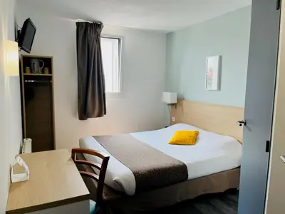 Un ou plusieurs lits dans un hébergement de l'établissement The Originals City, Hotel Novella Confort, Nantes Est