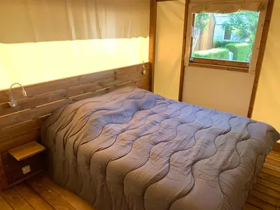 Un ou plusieurs lits dans un hébergement de l'établissement Camping Capfun La Bretèche