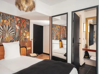 Un ou plusieurs lits dans un hébergement de l'établissement Billie Hôtel