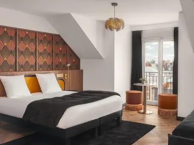 Un ou plusieurs lits dans un hébergement de l'établissement Billie Hôtel