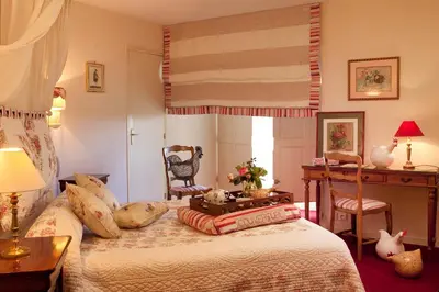 Un ou plusieurs lits dans un hébergement de l'établissement Chateau Colbert