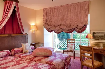 Un ou plusieurs lits dans un hébergement de l'établissement Chateau Colbert