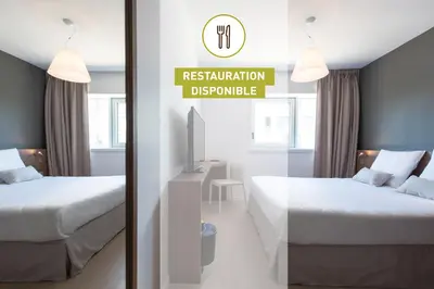 Un ou plusieurs lits dans un hébergement de l'établissement B&B HOTEL Saint-Nazaire Pornichet