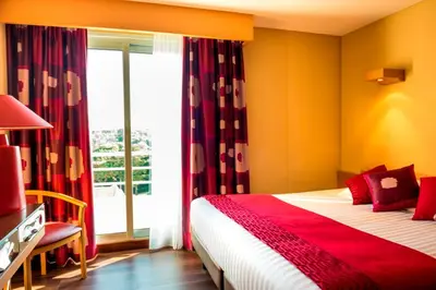 Un ou plusieurs lits dans un hébergement de l'établissement Hôtel Spa du Beryl St Brévin l'Océan