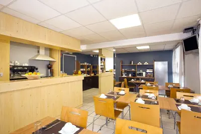 Cuisine ou kitchenette dans l'établissement Séjours & Affaires Nantes Ducs De Bretagne