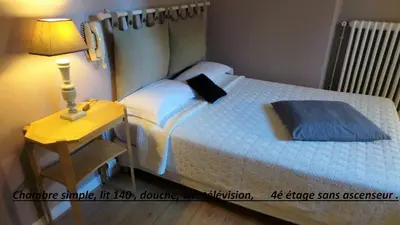 Un ou plusieurs lits dans un hébergement de l'établissement Hôtel Le Cambronne