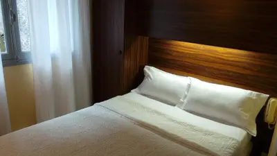 Un ou plusieurs lits dans un hébergement de l'établissement Hôtel Le Cambronne