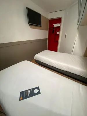 Un ou plusieurs lits dans un hébergement de l'établissement Première Classe Nantes Sud - Rezé Aéroport