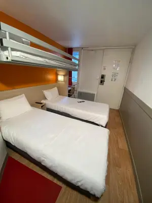 Un ou plusieurs lits dans un hébergement de l'établissement Première Classe Nantes Sud - Rezé Aéroport