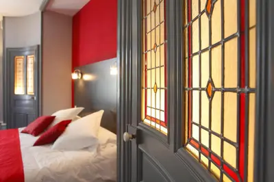 Un ou plusieurs lits dans un hébergement de l'établissement Hotel Château de la Barbinière
