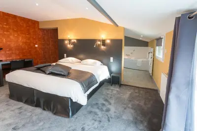 Un ou plusieurs lits dans un hébergement de l'établissement Hotel Château de la Barbinière