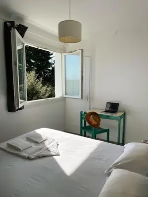 Un ou plusieurs lits dans un hébergement de l'établissement Maison Esperanza hôtel et appartement