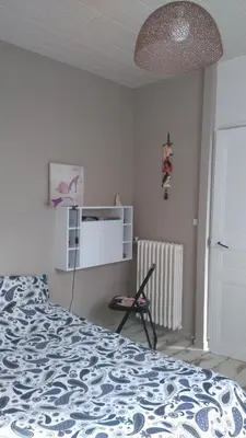 Un ou plusieurs lits dans un hébergement de l'établissement Chambre privée chez un particulier