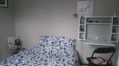 Un ou plusieurs lits dans un hébergement de l'établissement Chambre privée chez un particulier