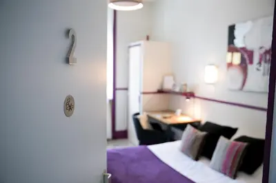Un ou plusieurs lits dans un hébergement de l'établissement Logis Auberge De L'ombrée