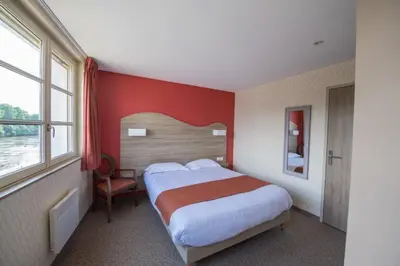 Un ou plusieurs lits dans un hébergement de l'établissement Hotel Hostellerie De La Gabelle