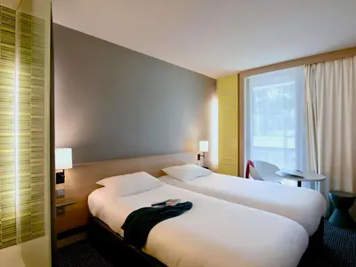 Un ou plusieurs lits dans un hébergement de l'établissement ibis Styles Nantes Reze Aéroport
