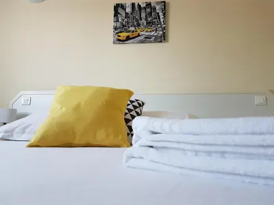 Un ou plusieurs lits dans un hébergement de l'établissement Hôtel Le Sainte Florence