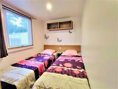 Un ou plusieurs lits dans un hébergement de l'établissement Bungalow confortable à Saint-Jean-de-Monts avec terrasse