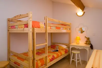 Un ou plusieurs lits dans un hébergement de l'établissement Madame Vacances les Mas de Saint Hilaire