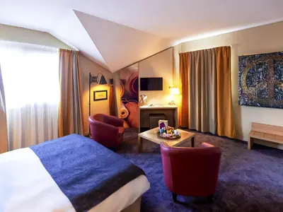 Un ou plusieurs lits dans un hébergement de l'établissement ibis Styles Cholet
