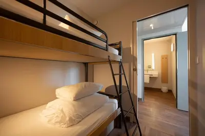 Un ou plusieurs lits dans un hébergement de l'établissement B&B HOTEL Les Herbiers