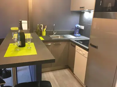 Cuisine ou kitchenette dans l'établissement Le Belouga