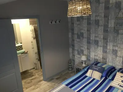 Un ou plusieurs lits dans un hébergement de l'établissement Les chambres du roc