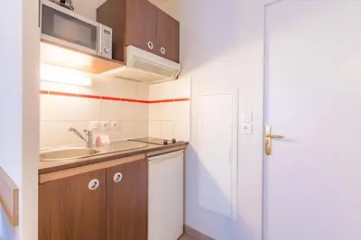 Cuisine ou kitchenette dans l'établissement Appart'City Classic La Roche sur Yon Centre