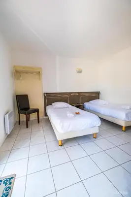 Un ou plusieurs lits dans un hébergement de l'établissement Hôtel Olydea Les Epesses - à 2,5km du PuyDuFou