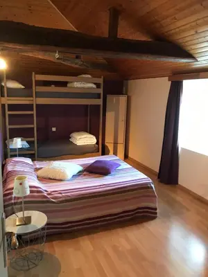 Un ou plusieurs lits dans un hébergement de l'établissement Gîte la Treille