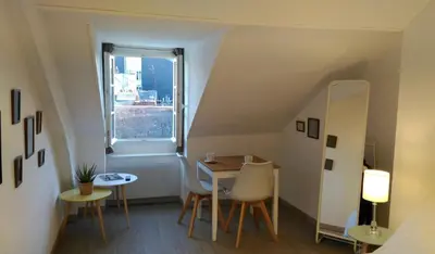 Coin salon dans l'établissement Mon Petit Studio Sous les Toits