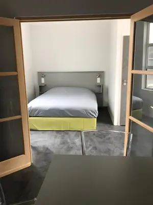 Un ou plusieurs lits dans un hébergement de l'établissement SmartAppart Saint Nazaire
