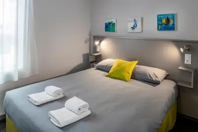 Un ou plusieurs lits dans un hébergement de l'établissement SmartAppart Saint Nazaire