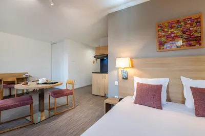 Un ou plusieurs lits dans un hébergement de l'établissement Appart'hôtel Odalys City - Nantes Cité des congrès