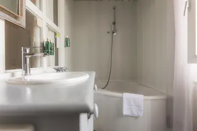Salle de bains dans l'établissement Hotel de Charme Le Sud Bretagne