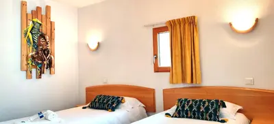 Un ou plusieurs lits dans un hébergement de l'établissement Hotel La Bosselle