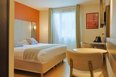 Un ou plusieurs lits dans un hébergement de l'établissement Seven Urban Suites Nantes Centre
