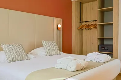 Un ou plusieurs lits dans un hébergement de l'établissement Seven Urban Suites Nantes Centre