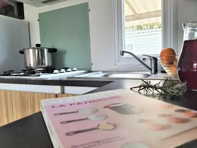 Cuisine ou kitchenette dans l'établissement Camping la Plage