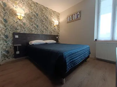 Un ou plusieurs lits dans un hébergement de l'établissement Hotel Restaurant L'Atlantique