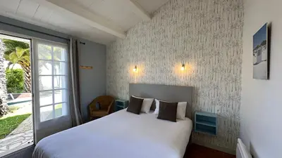 Un ou plusieurs lits dans un hébergement de l'établissement Hotel Le Goeland