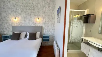 Un ou plusieurs lits dans un hébergement de l'établissement Hotel Le Goeland
