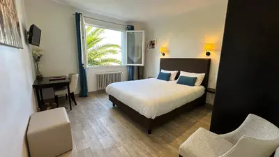 Un ou plusieurs lits dans un hébergement de l'établissement Hotel Le Goeland
