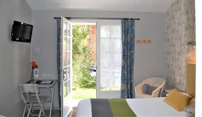 Télévision ou salle de divertissement dans l'établissement Hotel Le Goeland