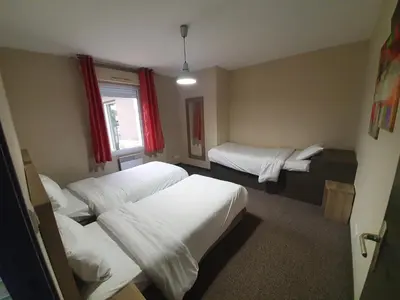 Un ou plusieurs lits dans un hébergement de l'établissement Hotel Salea