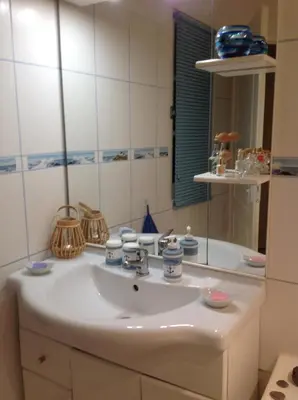 Salle de bains dans l'établissement LES ROCHES DE COIGNE