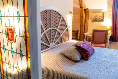 Un ou plusieurs lits dans un hébergement de l'établissement Chambres d'Hôtes Le Clos des 3 Rois