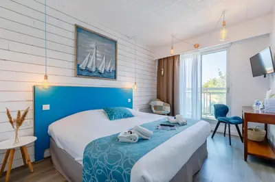 Un ou plusieurs lits dans un hébergement de l'établissement Hotel La Cote Oceane - Saint Jean de Monts